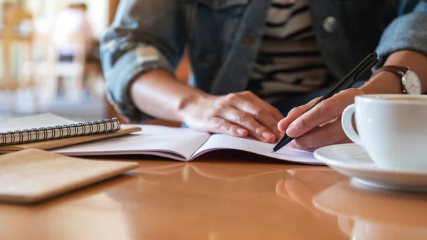 Closeup Image Woman Writing Notebook Table — ストック写真