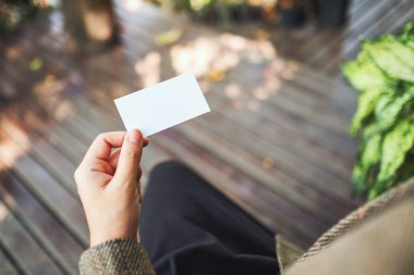 Businesswoman holding an empty business card