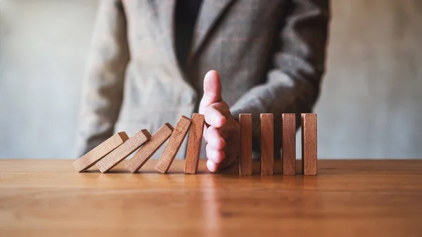 Closeup Image Businessman Hand Try Stopping Falling Wooden Dominoes Blocks —  Fotos de Stock