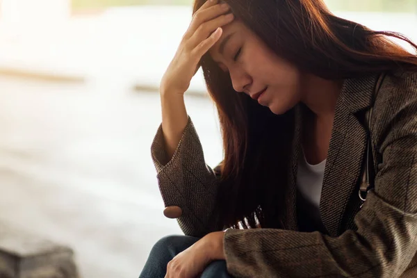 Stressed Young Asian Woman Sitting Alone — Photo