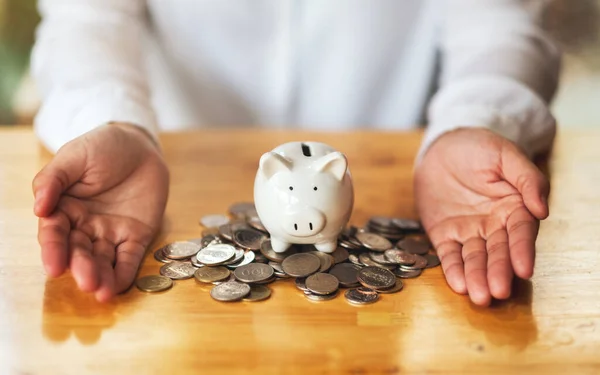 Closeup Image Woman Hands Showing Piggy Bank Coins Table Saving — Fotografia de Stock