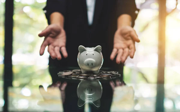 Closeup Image Woman Showing Piggy Bank Pile Coins Saving Money — Fotografia de Stock