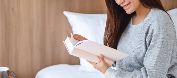 Closeup Image Beautiful Young Woman Reading Book White Cozy Bed Stok Resim