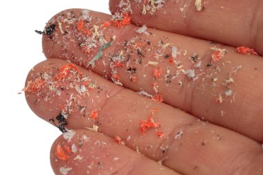 Hands full of microplastics. Different color of plastic. Concept of plastic pollution. Idea for climate change. clipart