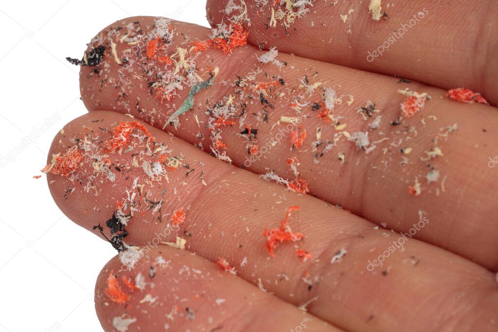 Hands full of microplastics. Different color of plastic. Concept of plastic pollution. Idea for climate change.