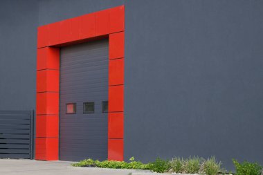 Rolling gate or roller shutter with application to factory, warehouse or hangar. Exterior. High angle shot