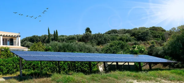 Solar batteries in the green home garden. Green energy concept. Solar energy