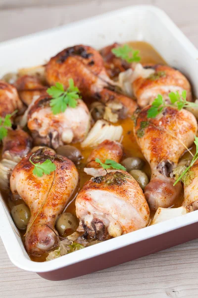 Roast chicken drumsticks with olives — Stock Photo, Image