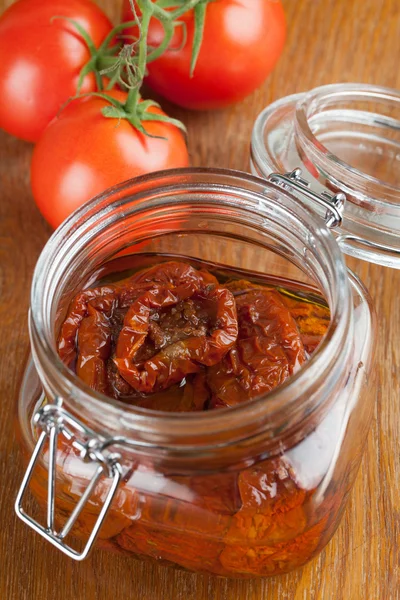 Dried tomatoes in a jar — Stock Photo, Image