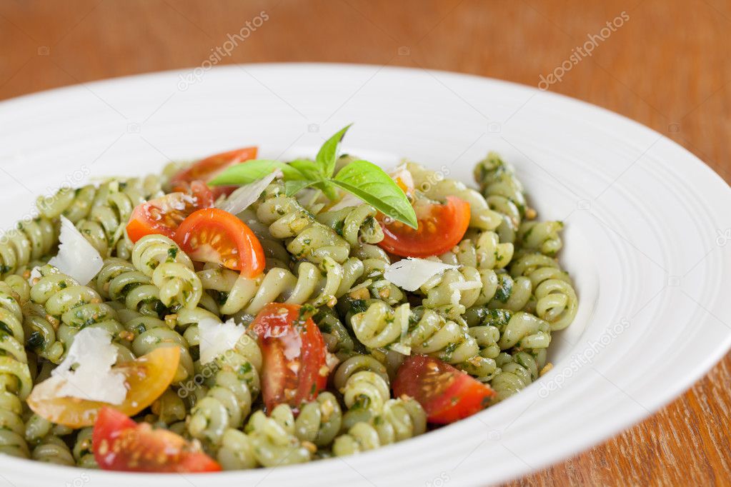 Fusilli with pesto, cherry tomatoes and parmesan