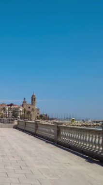 Vertical view of the Sitges seafront with the church of San Bartomeu i Santa tecla in the background, Province of Barcelona.