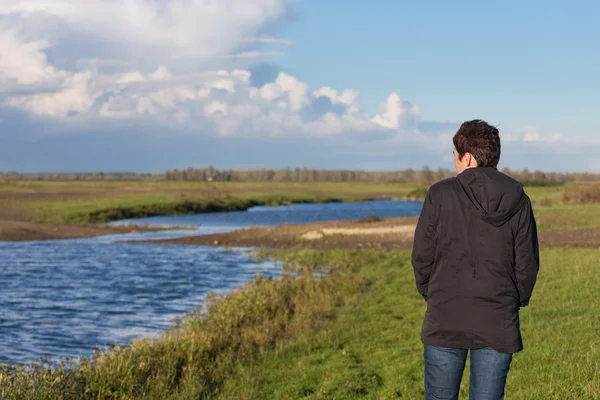 Woman in a beautiful wetland landscape in the Netherlands — Stock Photo, Image