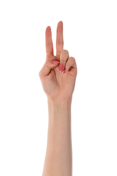 Mano femenina mostrando dos dedos aislados sobre fondo blanco — Foto de Stock