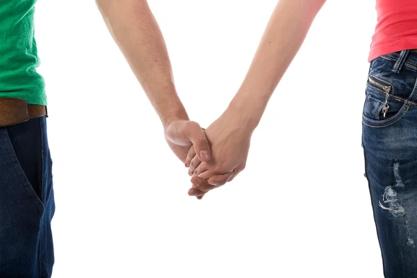 Młoda para trzymająca się za ręce na białym tle — Zdjęcie stockowe