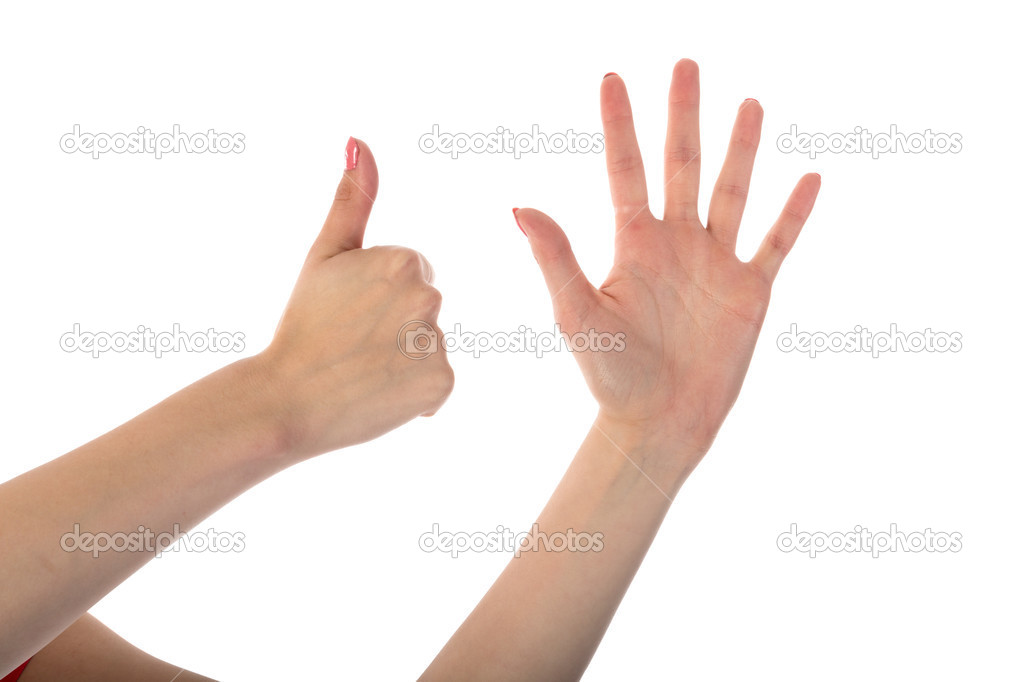 Female hands showing six fingers isolated on white background