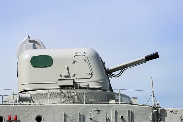 Metal canon on deck of a museum battleship — Stock Photo, Image