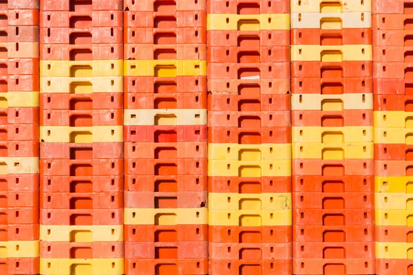 Colorful background of piled plastic crates — Stock Photo, Image