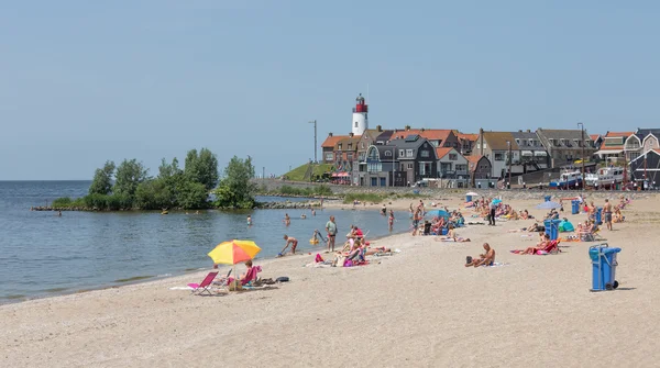 URK- JULY 06: Unknown people are sunbathing and swimming at the — Stock Photo, Image