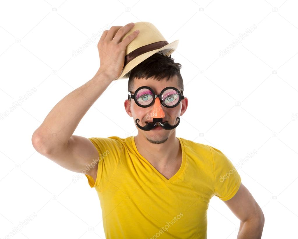 Man with funny mask and hat isolated on white