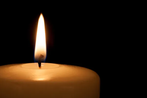 White candle on black background with copy space for text — Stock Photo, Image