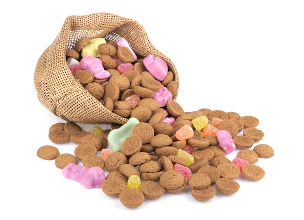 Bolsa de yute con nueces de jengibre y dulces . Imagen de stock