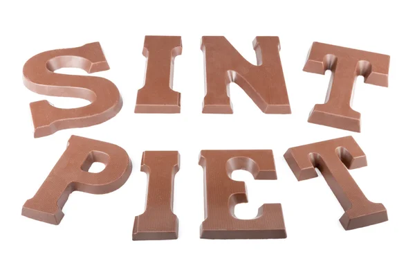 Letras de chocolate haciendo la palabra 'Sint' y 'Piet' — Foto de Stock