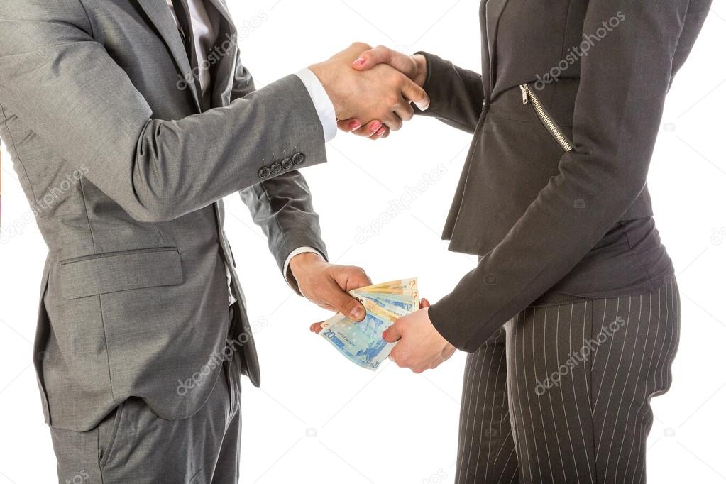 Man gives woman money while shaking hands