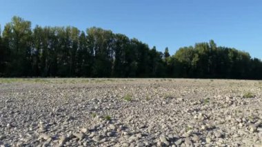 River in Drought Conditions due to global warming and climate change leaving the ground exposed. slow panning