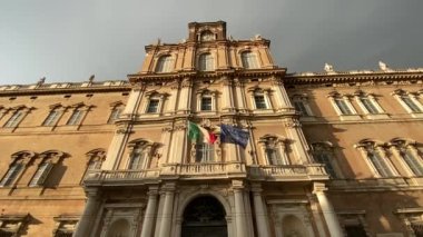 slow motion of italian and european flags flying in the wind on government palace facade. italian political elections