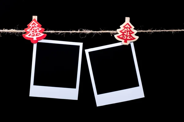 Blank photos hanging on rope — Stock Photo, Image