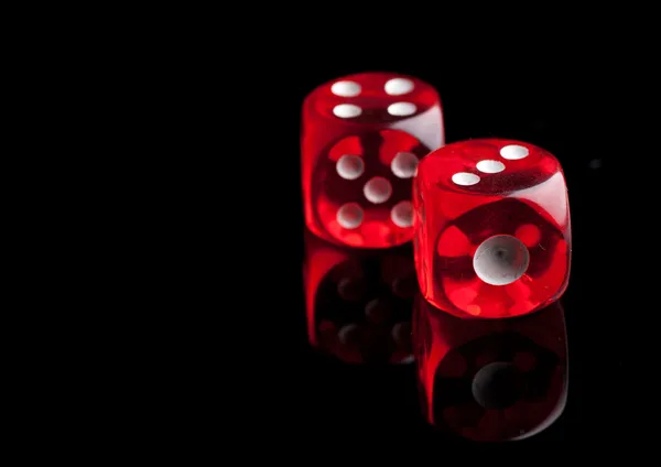 Two red dice on black background — Stock Photo, Image