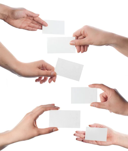 Set of hands holding empty business cards on white — Stock Photo, Image