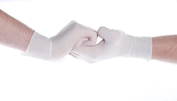 Shaking hands in medical gloves — Stock Photo, Image