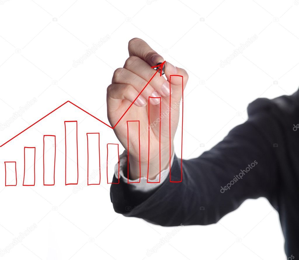 Business man drawing graphs