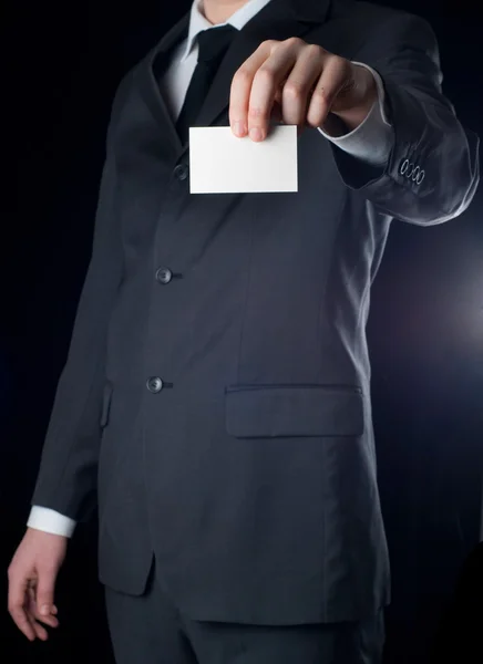 Business man handing a business card — Stock Photo, Image