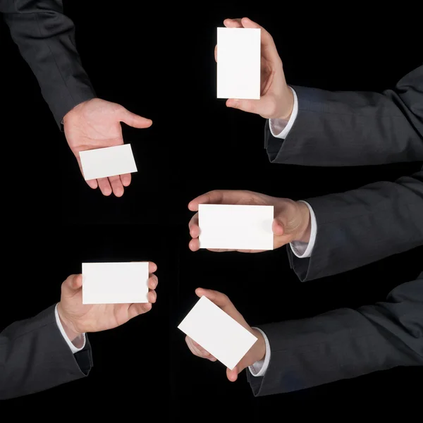 Hands hold business cards collage on black — Stock Photo, Image