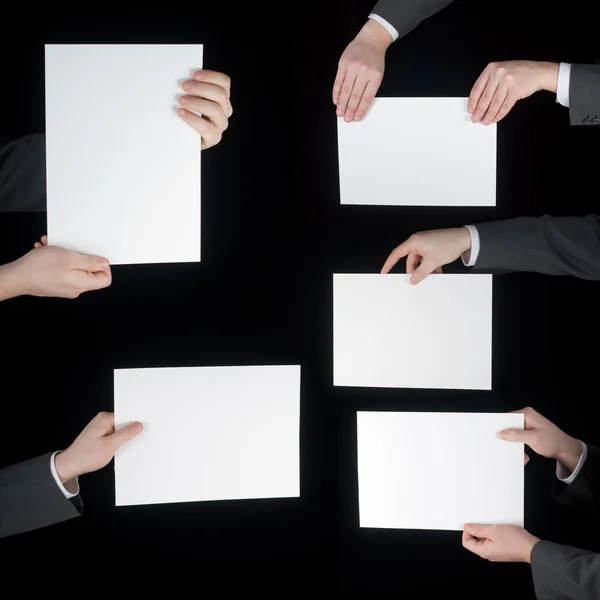 Colección de papel en blanco de mano sobre negro — Foto de Stock