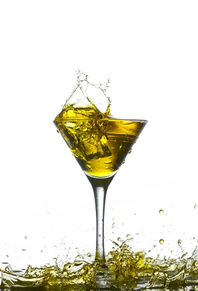 Yellow cocktail with splashes — Stock Photo, Image