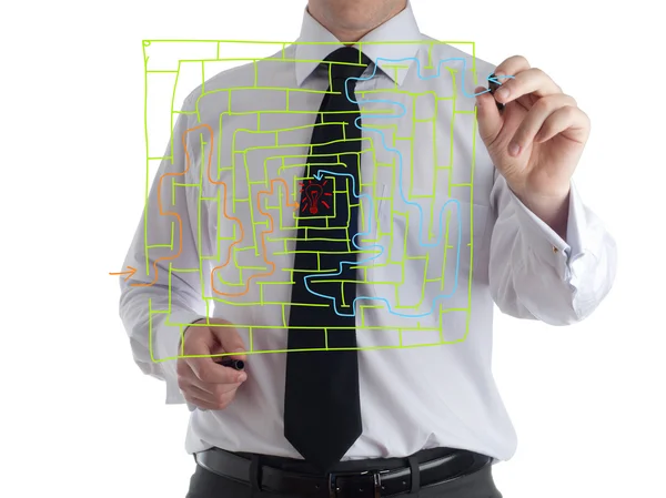 Man drawing labyrinth and red arrow — Stock Photo, Image