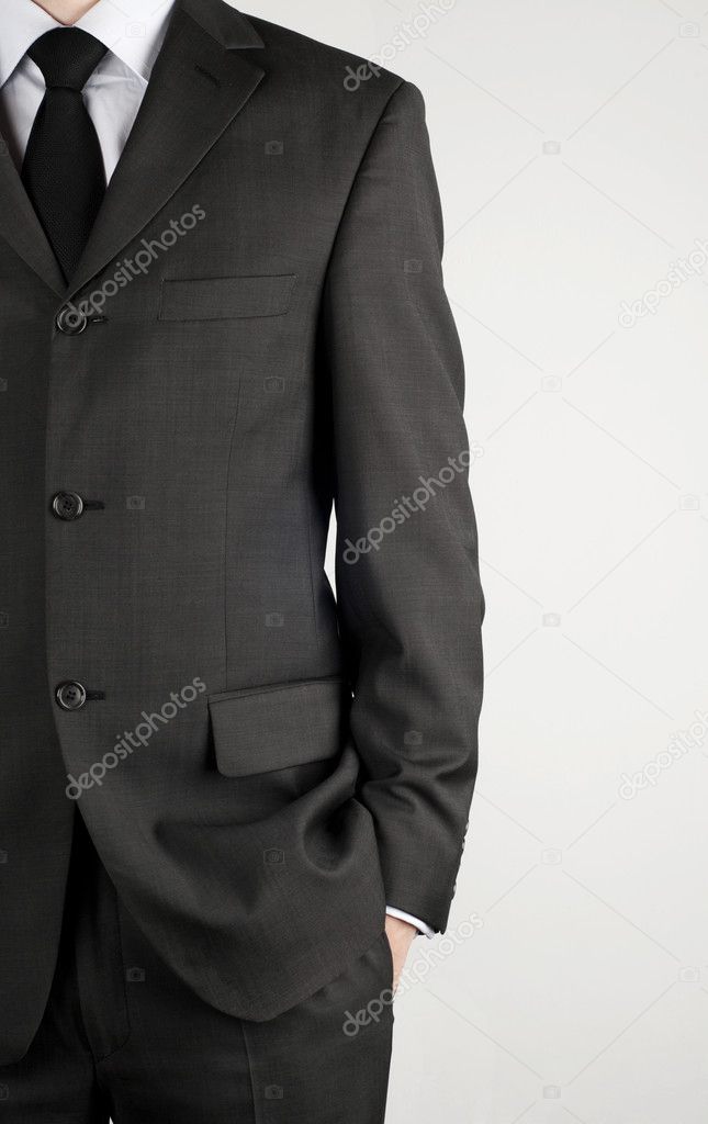 Dark business suit with a tie