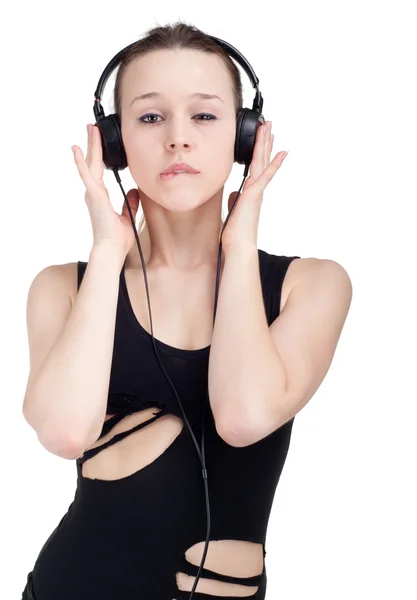 Žena se sluchátky poslech hudby . — Stock fotografie
