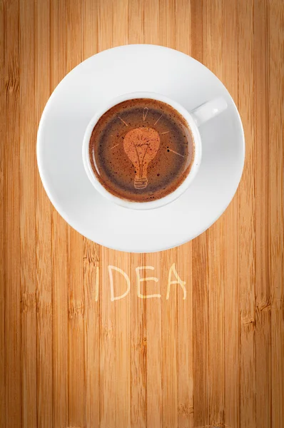 Idea. Cup of on wooden background — Stock Photo, Image