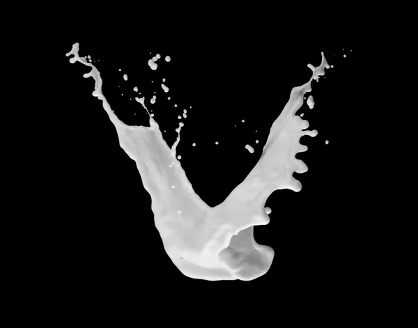 Milk splash in air isolated on black — Stock Photo, Image