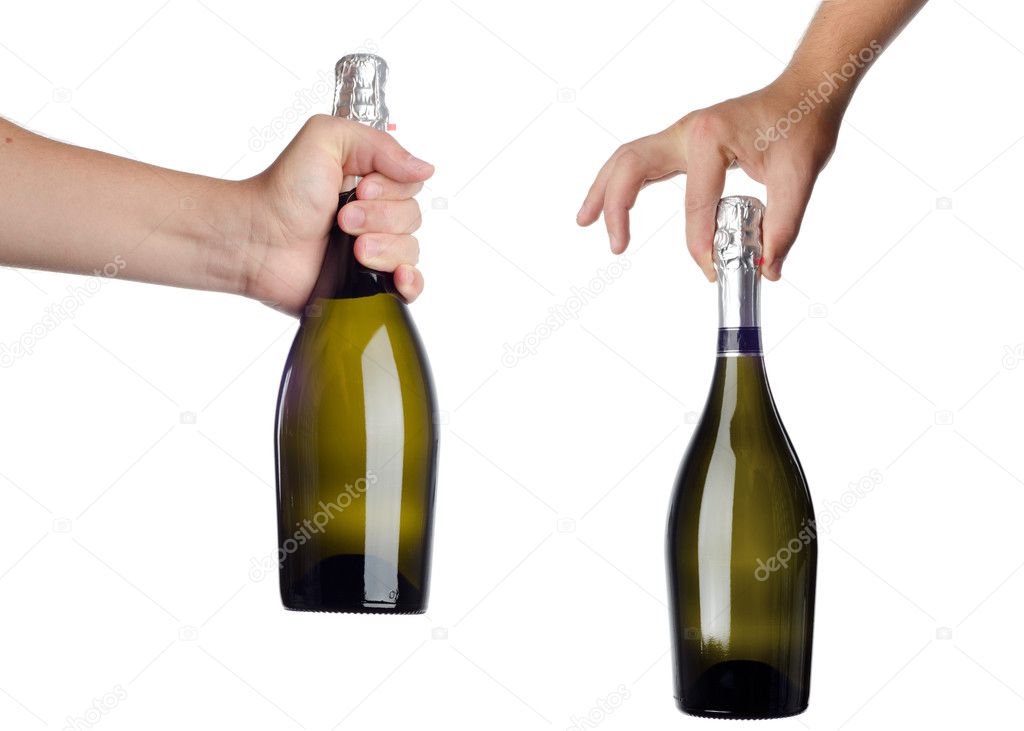 Hand holding bottle of champagne isolated on white