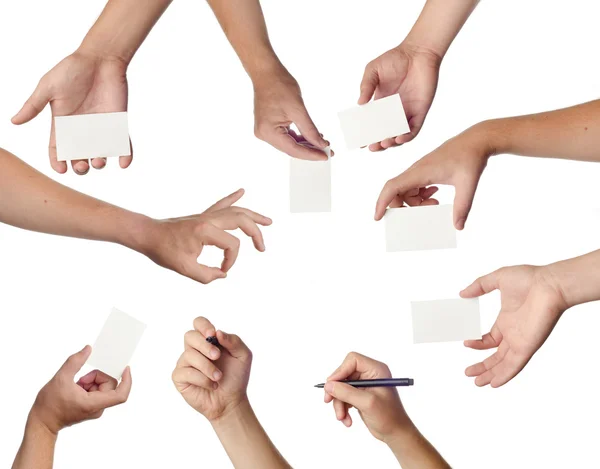 Conjunto de manos con tarjetas de visita vacías en blanco — Foto de Stock