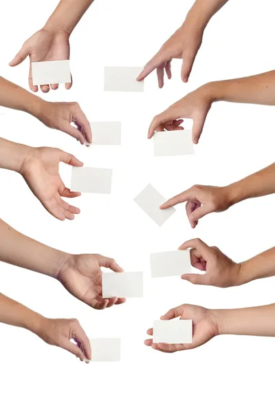 Conjunto de mãos segurando cartões de visita vazios no branco — Fotografia de Stock
