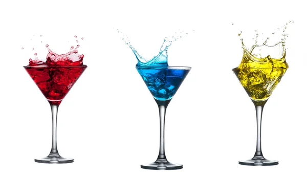 Red cocktail splashing into glass on white — Stock Photo, Image