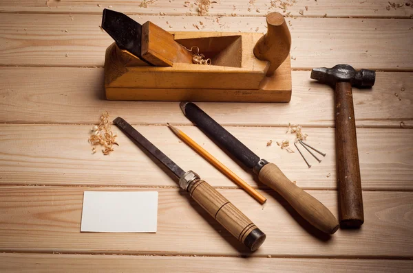 Desk of a carpenter with some tools — Stock Photo, Image