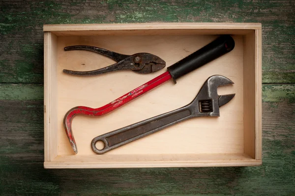 Some carpenter tools on wooden box — Stock Photo, Image