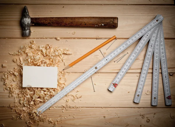 Desk of a carpenter with some tools — Stock Photo, Image